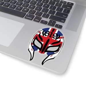 May include: A wrestling mask with a black and white design, featuring the Union Jack flag with the number 619 in the center.