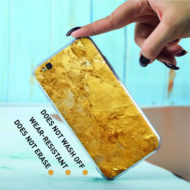 a person holding a cell phone in their hand