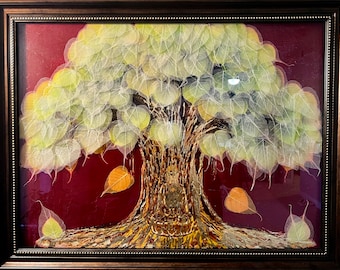 May include: A framed artwork featuring a tree made of delicate, translucent leaves in shades of green and yellow. The leaves are arranged in a circular pattern, creating a sense of growth and abundance. The tree is set against a deep red background, adding a touch of warmth and vibrancy to the piece.