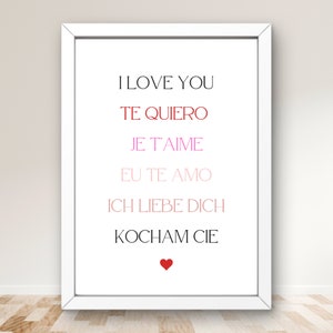 May include: A framed print with the words "I LOVE YOU" in English, and translations in Spanish, French, Portuguese, German, and Polish. The text is in various colors, with a red heart at the bottom.