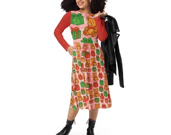 May include: A long-sleeved dress featuring a festive pattern of teddy bears and wrapped gifts on a pink background. The dress has red sleeves and a scoop neck. The person is wearing black boots and holding a black jacket.