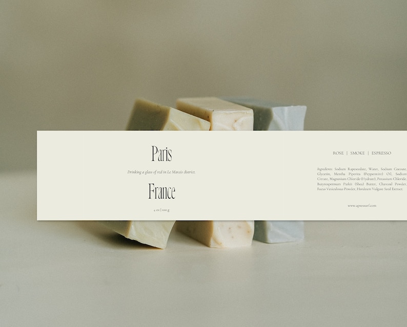May include: Three bars of soap, one in rose, one in smoke, and one in espresso, with the text "Paris Drinking a glass of wine in Le Marais district France" and "ROSE | SMOKE | ESPRESSO" on a white background.
