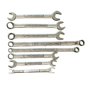 May include: A collection of Craftsman spanners in various sizes, displayed against a white backdrop. The spanners are silver, featuring open-end and ring-end designs. Sizes vary from 9mm to 24mm, with clear markings. The Craftsman logo is present on each spanner.