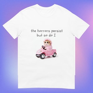 The Horrors Persist But So Do I Tee - White Funny Unisex T-Shirt with Glamorous Pink Hamster - Funny Gift for Her - Meme Funny Text T-Shirt