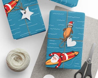 Papier cadeau Père Noël surfeur et loutre