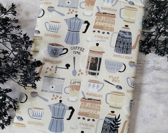 May include: A beige fabric pouch with a coffee theme. The pouch is decorated with a variety of coffee cups, coffee beans, and coffee makers. The text on the pouch includes "Coffee Time", "Fresh Coffee", "Espresso", "Cappuccino", "Latte", "Macchiato", "Americano", "Double Shot", and "Flat White".
