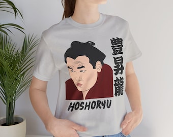 May include: A gray t-shirt with a cartoon illustration of a sumo wrestler with the text "HOSHORYU" and Japanese characters below the image.