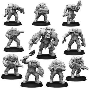 Puede incluir: Un conjunto de nueve figuras en miniatura de plástico gris de orcos, cada una con diferentes armas y armaduras. Las figuras están en varias posturas de acción.