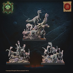 May include: Three sets of miniature dinosaur figurines from the Cuetzpal Empire Remastered Vol II collection. Each set features multiple small, grey, bipedal dinosaur models posed on textured bases with sculpted foliage and tree-like structures.