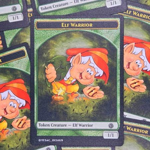 May include: A collection of rectangular game cards featuring an illustration of an elf warrior with a red hat, yellow pants, and a green tunic. The card text reads Elf Warrior, Token Creature - Elf Warrior, 1/1, and @YESAC_DESIGN.