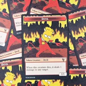 May include: A collection of "Devil" token cards featuring a cartoon character in a red devil costume with a pitchfork. The cards have a black background with flames and text that reads "Token Creature - Devil".