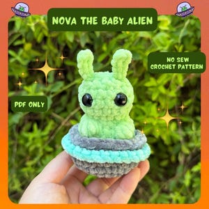 May include: A light green crocheted baby alien figure with large black eyes and two upright ears, sitting inside a gray and light blue crocheted UFO. The image includes text that reads: NOVA THE BABY ALIEN, NO SEW CROCHET PATTERN, and PDF ONLY.