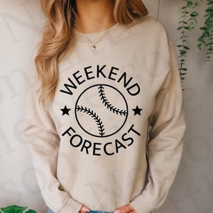 May include: A beige sweatshirt with a black graphic of a baseball and the text "Weekend Forecast".