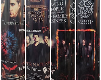 May include: A black and red tumbler with a Supernatural theme. It features the show's logo, characters, and quotes. The text includes "Saving People, Hunting Things, The Family Business", "Carry On My Wayward Son", "Every Loves Bacon", "The Road So Far", "Dude, You Just Got Whaled On By Paris Hilton", "Family Don't End With Blood, Boy!" and "Stay Stay Out Of My Phone, Demon!"