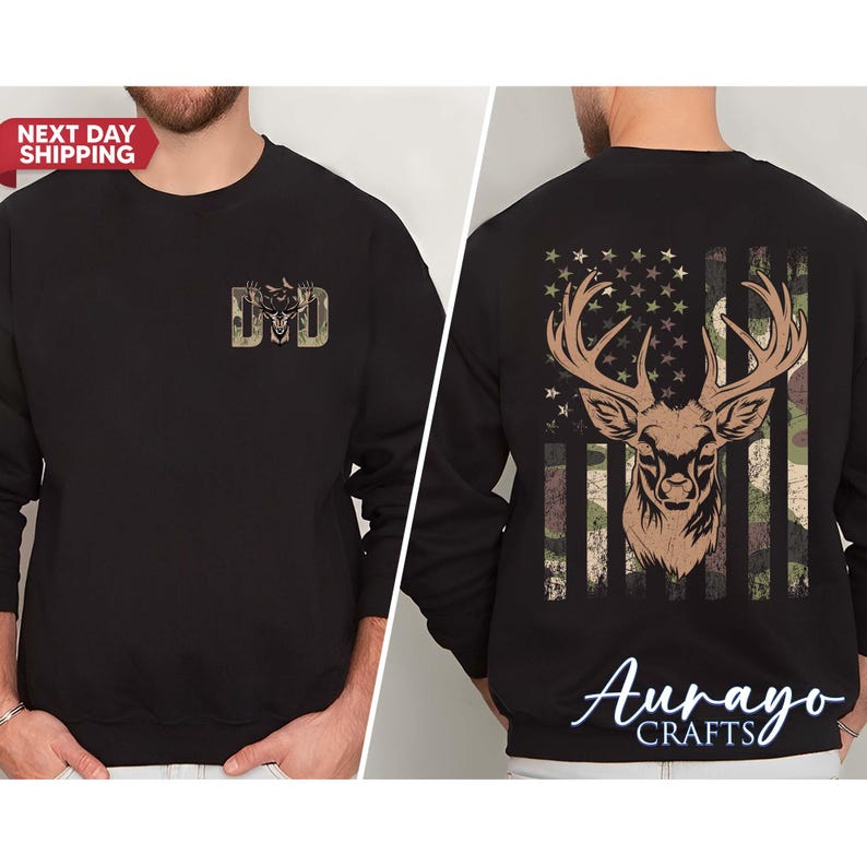 May include: Black sweatshirt featuring a deer head design with an American flag background. The front of the sweatshirt has the letters "DD" in a camouflage design. The back of the sweatshirt has a deer head with antlers and a camouflage design.