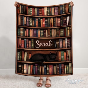 May include: A brown bookshelf with a black cat sleeping on a shelf. The bookshelf is filled with books and has the name "Sarah" written on it.
