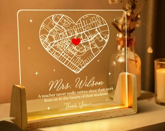 May include: A personalized LED night light with a heart-shaped map design, a red heart, and the name "Mrs. Wilson." The light includes the text "A teacher never really retires since their work lives on in the hearts of their students. Thank You."
