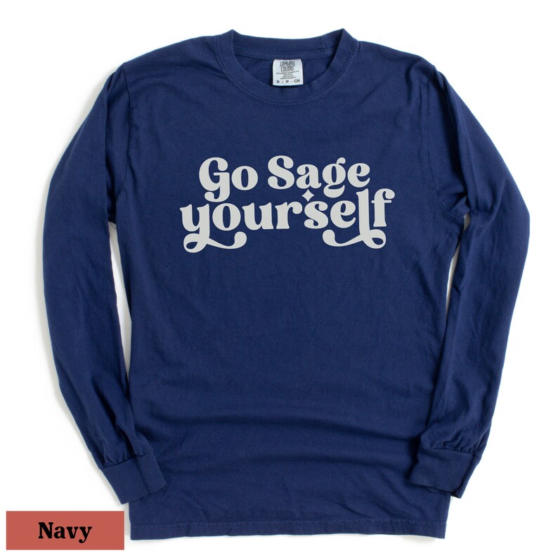 May include: Navy blue long-sleeve t-shirt with the text "Go Sage yourself" in white retro-style lettering.