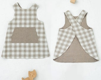 Sewing pattern for reversible cross back apron with a front pocket. Kid's apron for 1-10 years child.