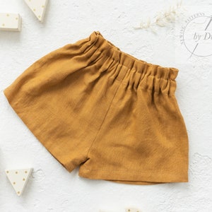 Sewing pattern for girls ruffled waist Shorts / Diaper covers. Simple but fancy Shorts Luna for baby girl from 1 month to 3 years.