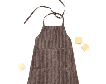 PDF Sewing pattern for layered kids apron Hubert with a front pocket. Apron for 2-11 years child.