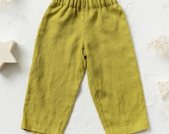 PDF file for the sewing pattern of loose fit pants for kids. Charlotte pants. Sizes 2-6 years.