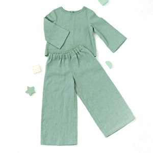 Set of Sewing patterns for top with long sleeves and wide leg pants for kids from 2 to 6 years.
