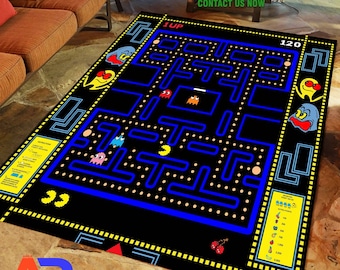 May include: Black area rug featuring a Pac-Man game design with a blue maze, yellow dots, and colorful ghosts. The rug has the text "1UP" and "120" on it. The rug also has the text "YOU CAN CUSTOMIZE THIS RUG OR DESIGN YOUR OWN. CONTACT US NOW."