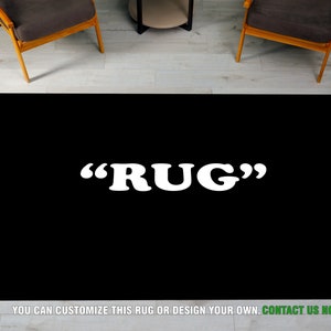 May include: A black rug with the word "RUG" in white letters. The text "YOU CAN CUSTOMIZE THIS RUG OR DESIGN YOUR OWN. CONTACT US NOW" is printed at the bottom of the rug.
