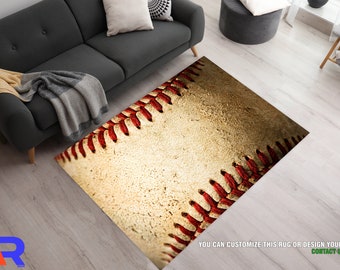 May include: A close-up of a baseball rug with red stitching. The rug is made of a textured material that looks like a worn baseball. The rug is perfect for any baseball fan.