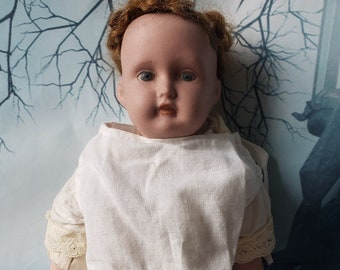 DPCo. English bisque pottery doll . Early 20th Century