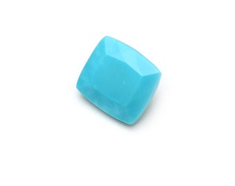 May include: A bright blue, square-shaped turquoise gemstone.