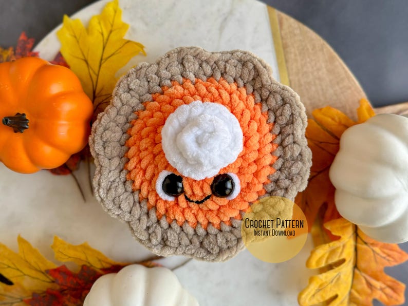 May include: Crochet pattern for a cute pumpkin pie amigurumi with a white whipped cream topping, brown crust, and orange filling. The pattern is available for instant download.