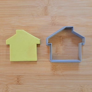 Tagliabiscotti a casa aperta dell'agente immobiliare. Targa pubblicitaria biscotto. Fondente PLA stampato in 3D, pasta, plastilina, Play-Doh, tagliapasta