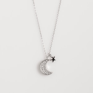 Zilveren maan en ster ketting