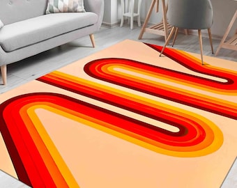 May include: A retro-style area rug with a cream background and a multi-colored design of curved lines in shades of orange, red, and brown.