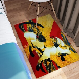 May include: A red, yellow, and black area rug with a stylized design of two Siamese cats. The cats are intertwined and appear to be playing.