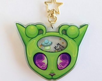 Llavero agitador de gato alienígena