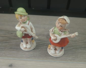 German porcelain Oktoberfest boy and girlFigurines Guitar mandolin Vintage