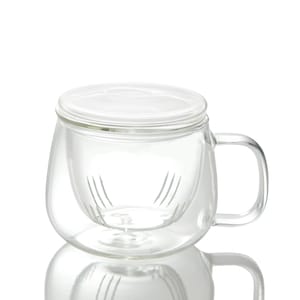May include: A clear glass tea mug with a double-walled design and a removable lid. The mug has a built-in infuser for loose leaf tea.