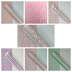 May include: Assortment of wrapping paper rolls with various patterns.  The patterns include pink and white geometric designs, red and white confetti, red and white polka dots, pink and white gingham, and green and white gingham.