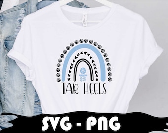 May include: White t-shirt with a blue and black basketball rainbow design and the text "TAR HEELS".