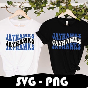May include: Two t-shirts with the text "JAYHAWKS" in a blue and white wavy font. The shirts are white and black.
