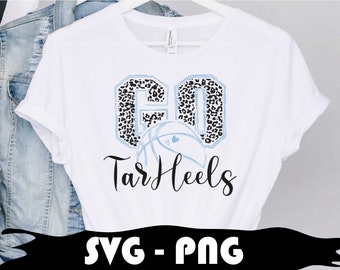 May include: White t-shirt with the text "GO Tar Heels". The letters "GO" are in a light blue outline with a black and white leopard print pattern. A basketball with a light blue heart is below the letters. The words "Tar Heels" are in black script.