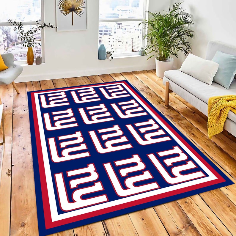 May include: A blue and red area rug with a white repeated pattern of the letter "N" in a stylized font.