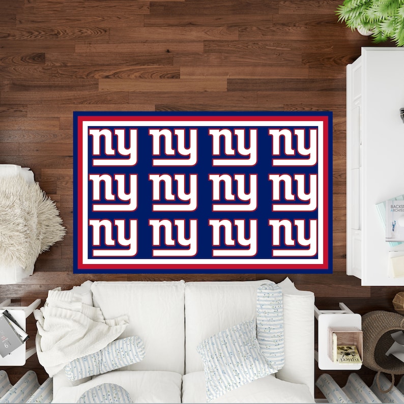 May include: A blue and white rug with the letters "NY" repeated in a grid pattern. The rug has a red border.