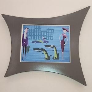 May include: A framed illustration of a man and woman walking down a city street with two alligators on leashes. The man is wearing a purple suit and the woman is wearing a red dress and a hat. The illustration is in a modern style with bold colors and simple lines.