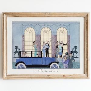 May include: A framed vintage art print depicting a group of people in 1920s attire standing in front of a grand building with a blue car parked in front of them. The print features a light blue car with a black roof and a white steering wheel. The text "Au revoir..." is written at the bottom of the print.