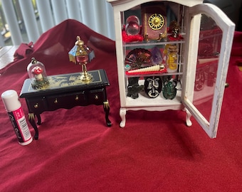 Dollhouse oddities cabinet and table. Bring wonders to your doll house or regular house, if you prefer.