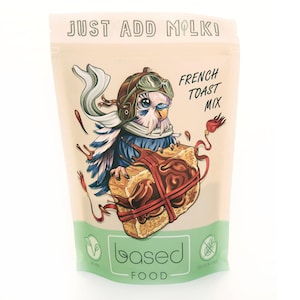 May include: A beige pouch with a cartoon illustration of a blue bird wearing a brown leather aviator hat and goggles, holding a brown and yellow French toast. The text "JUST ADD MILK!" is at the top of the pouch, and "FRENCH TOAST MIX" is in the upper right corner. The pouch also has the text "based FOOD" and a green vegan symbol and a green gluten-free symbol.